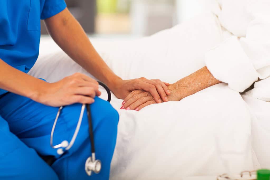 A clinician supporting an older patient